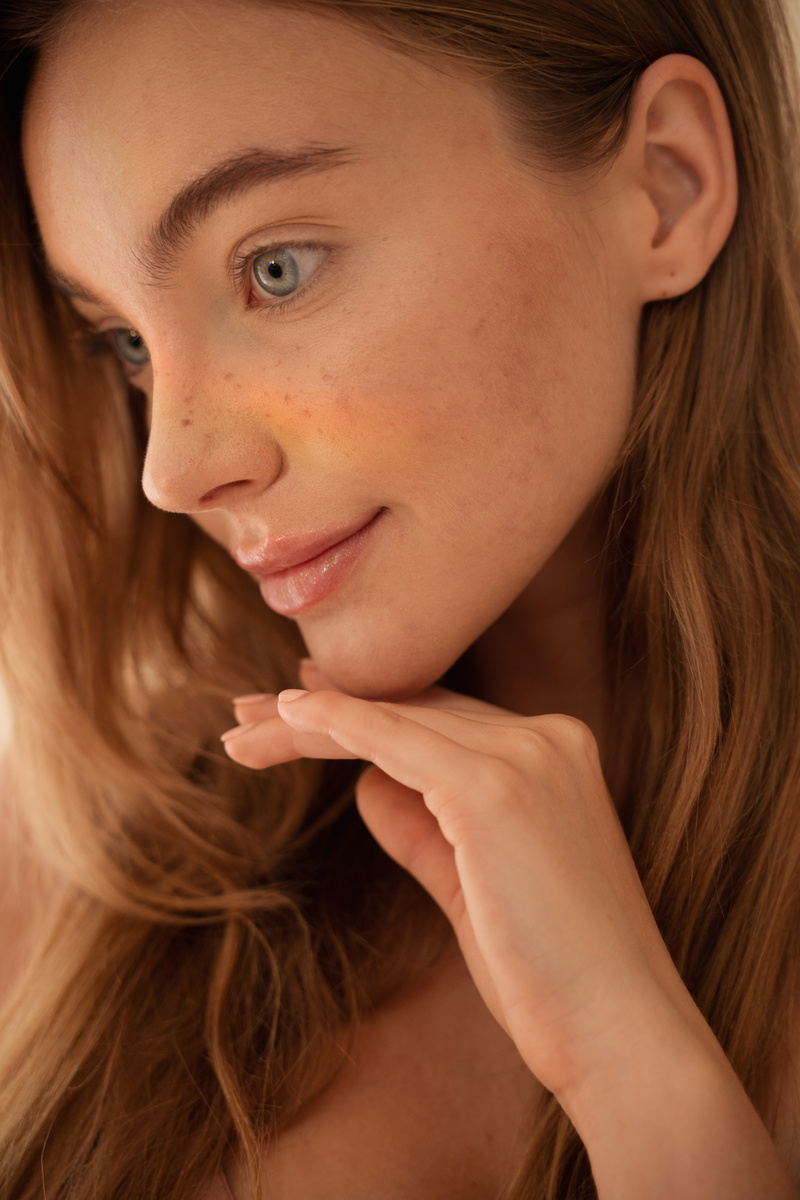 Woman's Face with Freckles and Prism Reflection